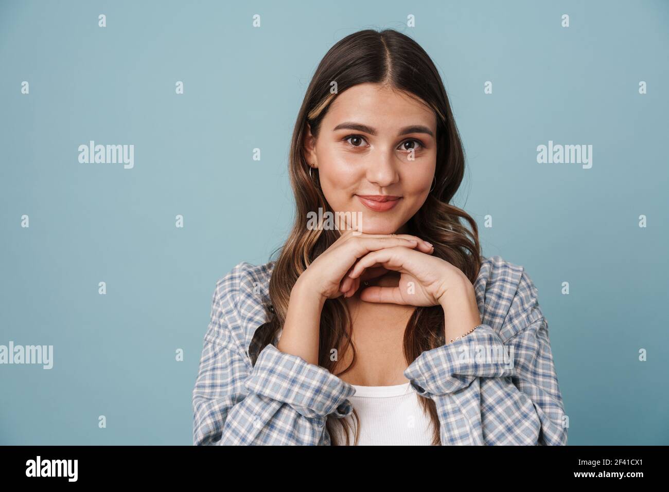Happy beautiful nice girl smiling and looking at camera isolated over ...
