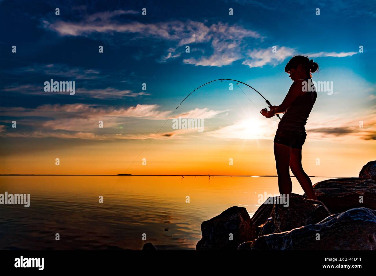 Woman fishing summer hi-res stock photography and images - Page 5 - Alamy