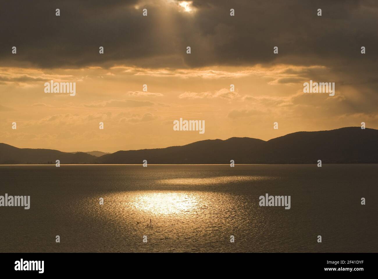 Sunbeams on the Trasimeno lake, Umbria, Italy Stock Photo