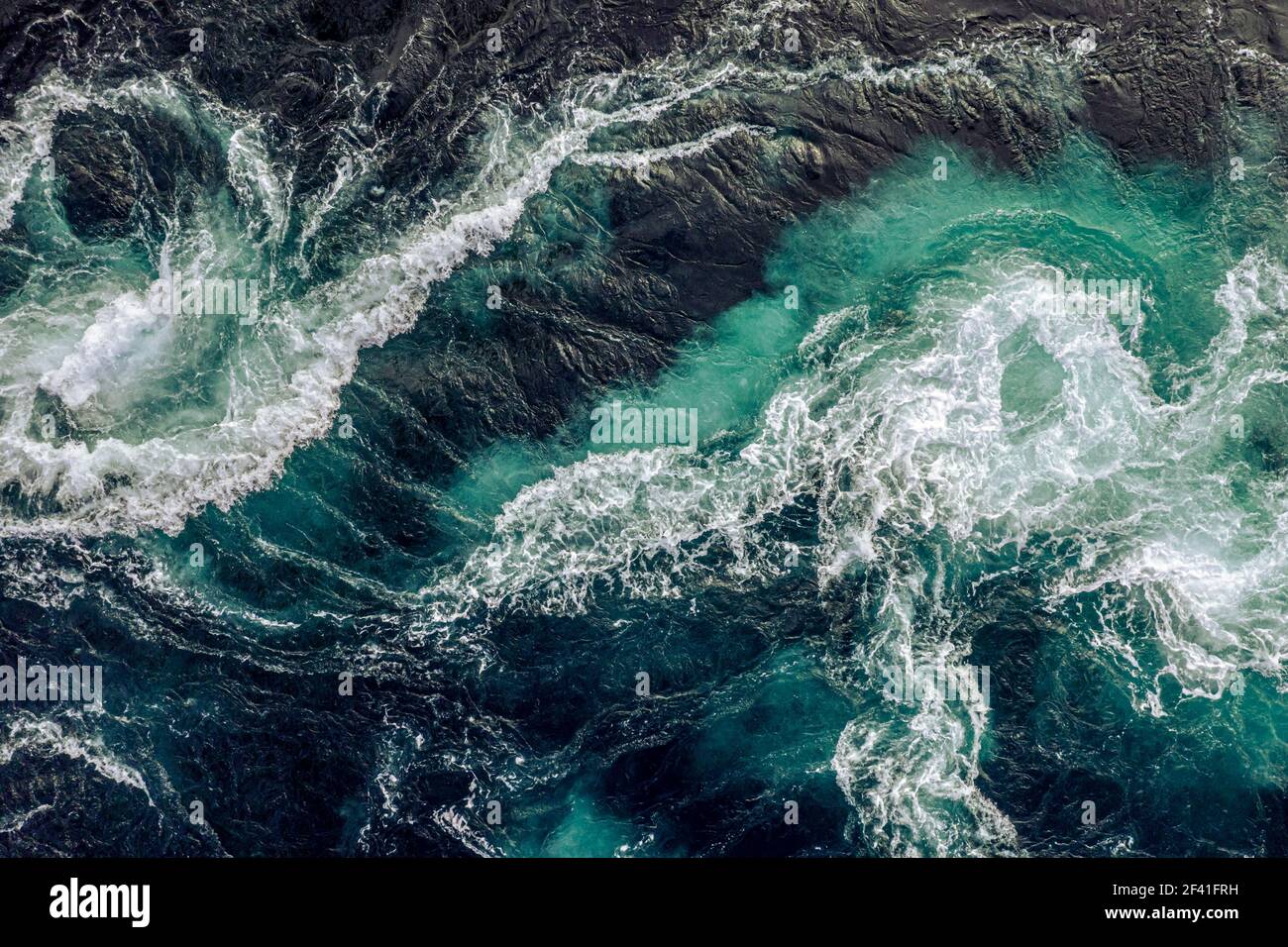 https://c8.alamy.com/comp/2F41FRH/abstract-background-waves-of-water-of-the-river-and-the-sea-meet-each-other-during-high-tide-and-low-tide-whirlpools-of-the-maelstrom-of-saltstraumen-nordland-norway-2F41FRH.jpg