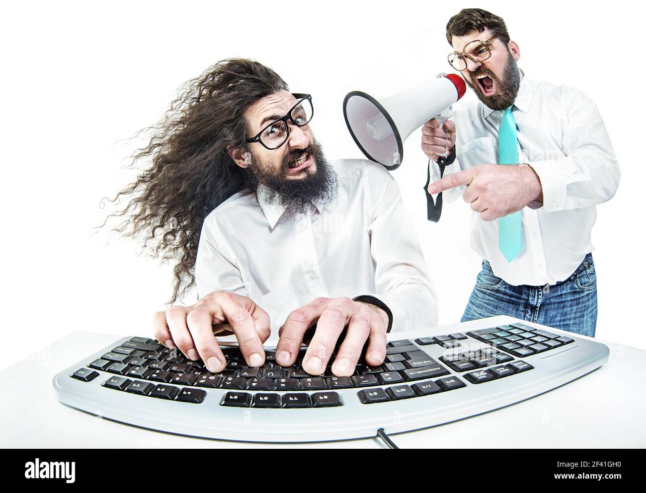 Bully boss yelling at the nerdy employee Stock Photo