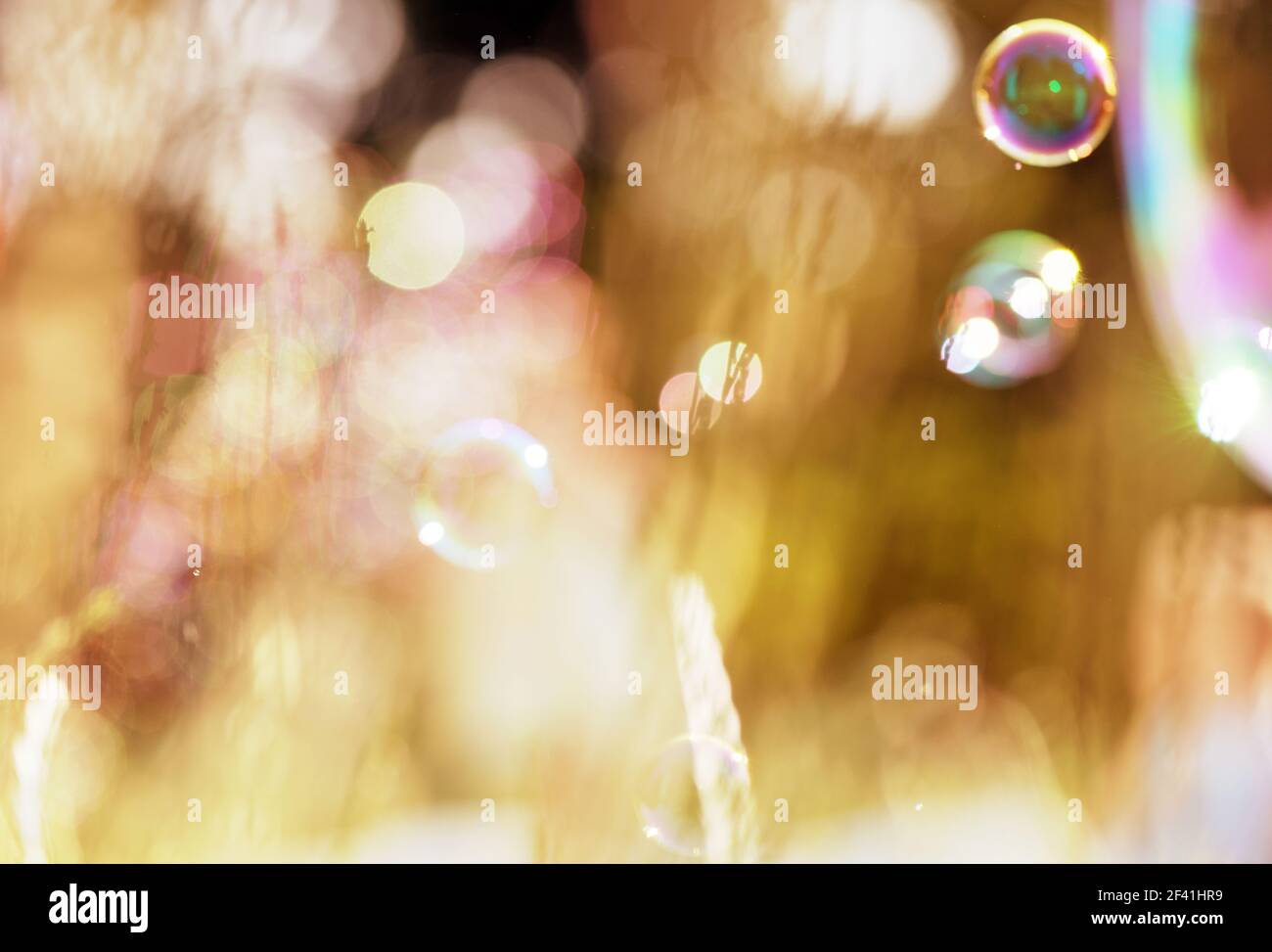 soap bubbles on a blurry green background Stock Photo