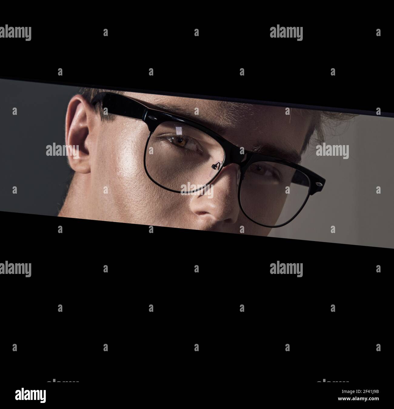 Portriat of a young guy wearing the eyeglasses Stock Photo