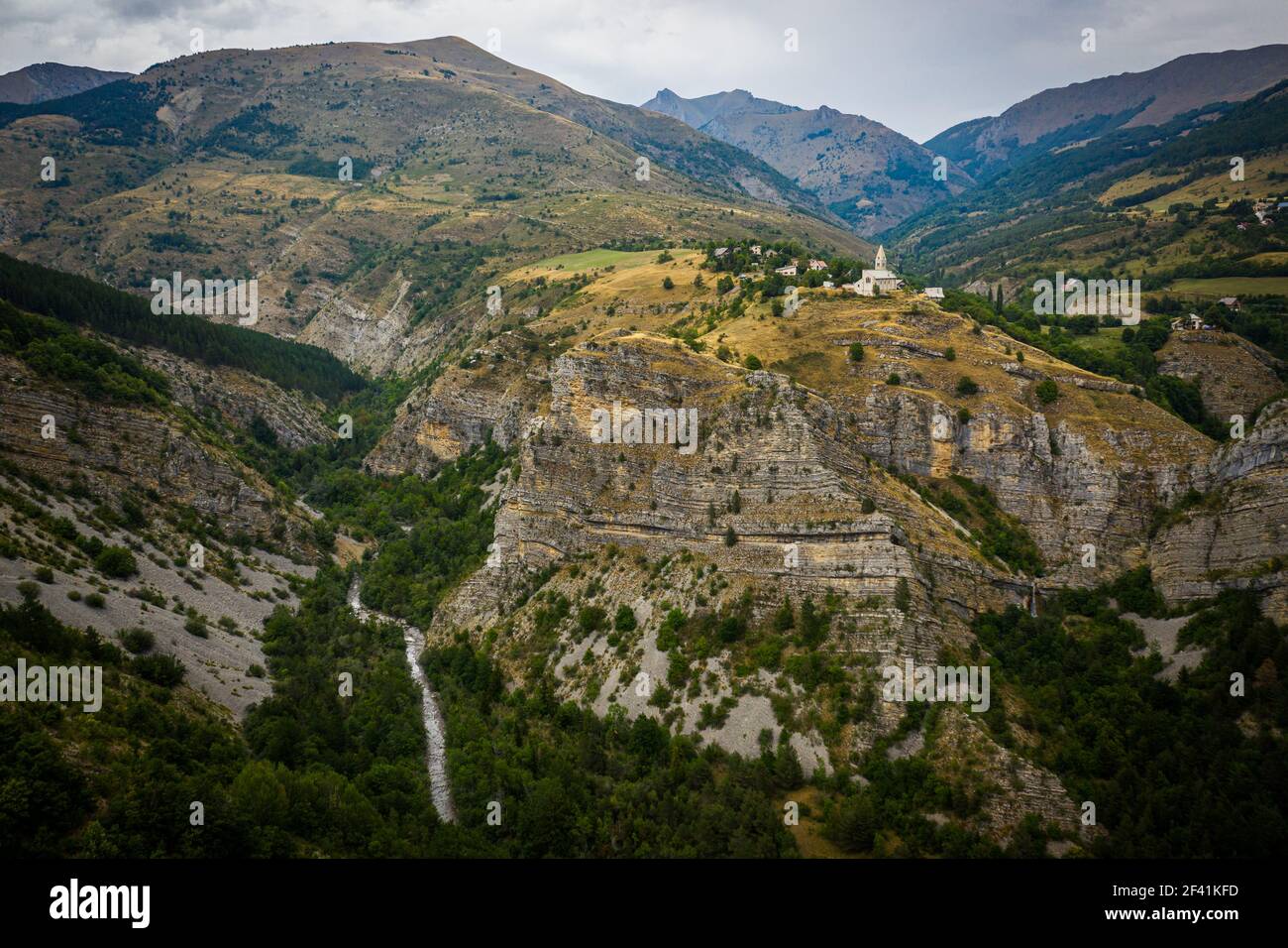 Aerial view of small village with a church on a mountain peak near Annecy, France Stock Photo