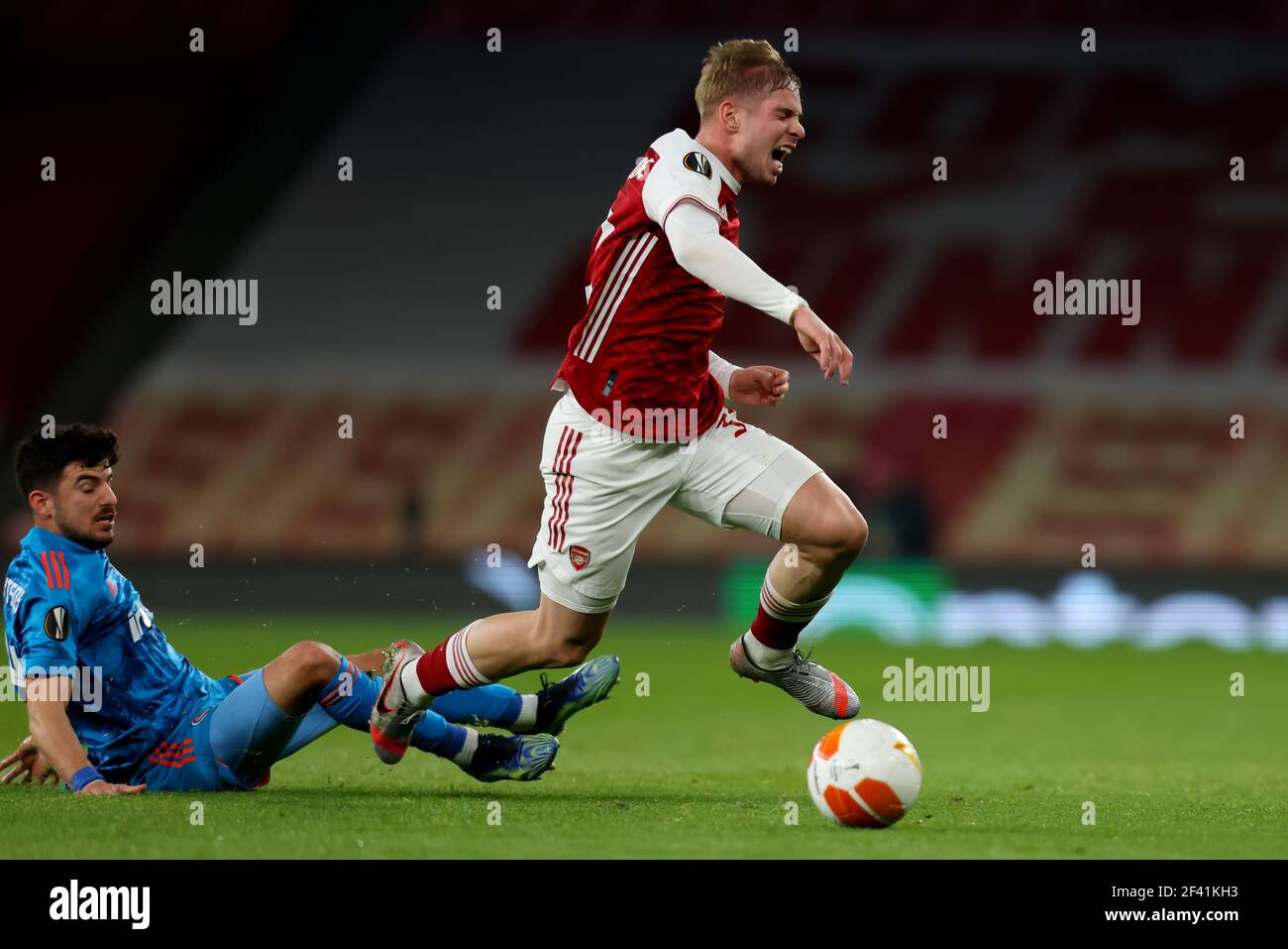 Emirates Stadium, London, UK. 18th Mar, 2021. UEFA Europa League Football,  Arsenal versus Olympiacos; Thanasis Androutsos of Olympiakos fouls Emile  Smith Rowe of Arsenal from behind Credit: Action Plus Sports/Alamy Live News