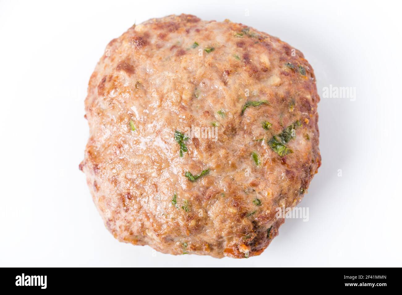 Delicious pork burger cutlet with fresh greens. Macro. Photo can be