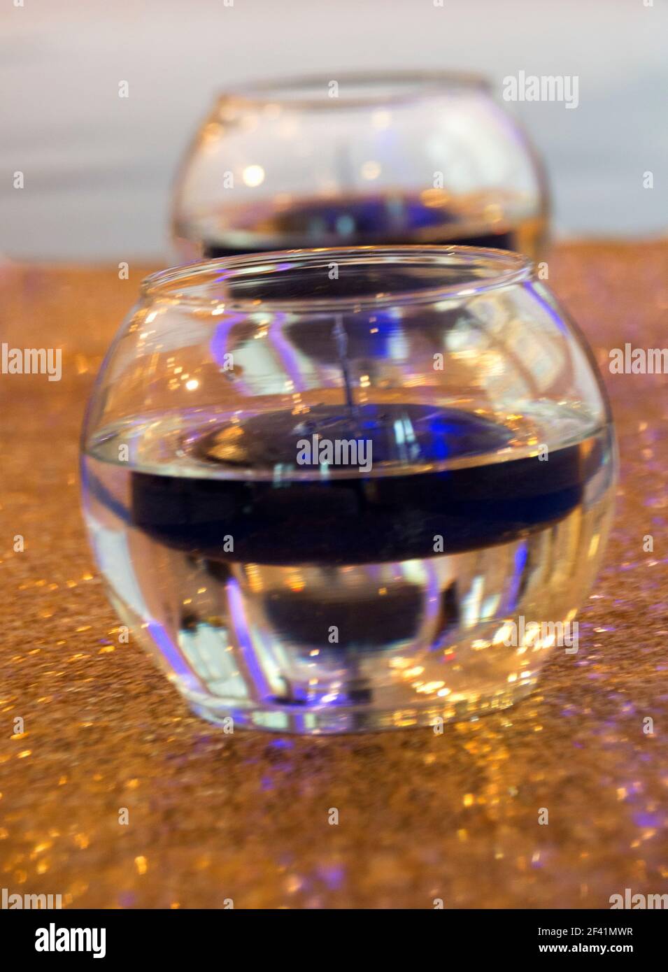 Glass bowls with floating candles Stock Photo Alamy