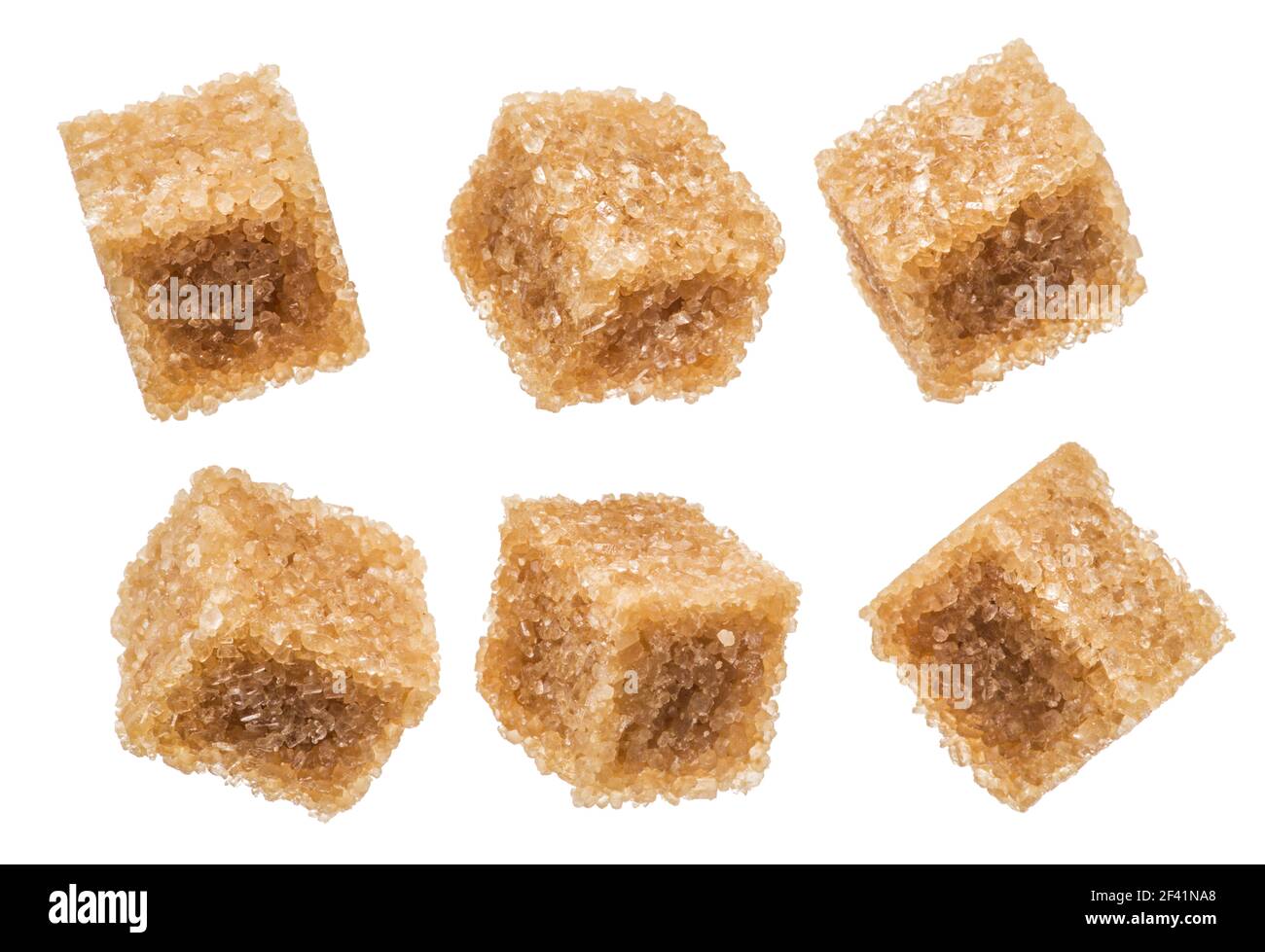 Brown sugar cubes on white background. Macro picture. Stock Photo