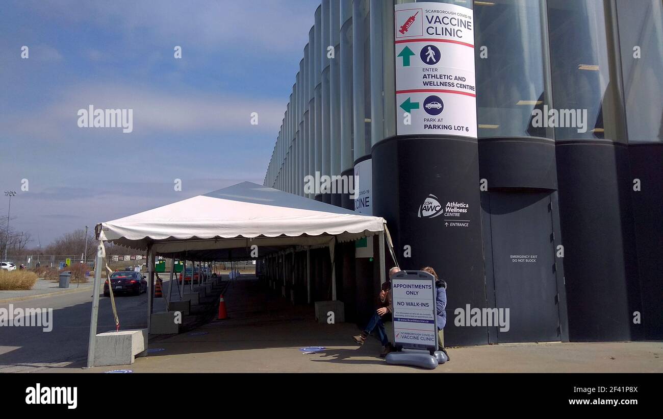 Toronto, Ontario, Canada - 03/17/2021: The outdoor tent was set up for people to the lineup at the Athletic Centre that uses as the distribution of ma Stock Photo