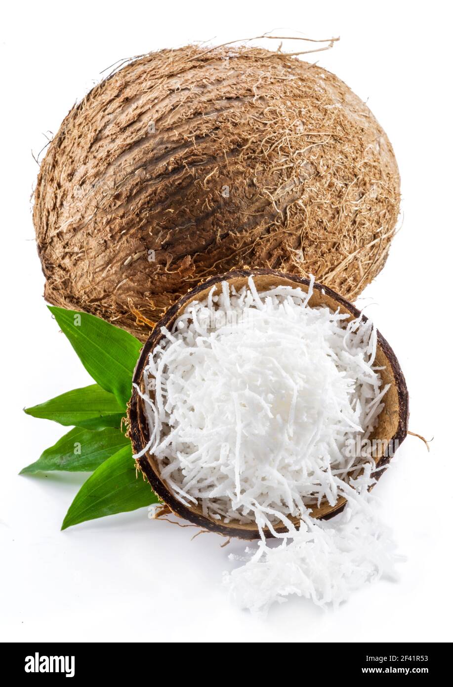 Coconut fruit and shredded coconut flesh isolated on white background. Stock Photo