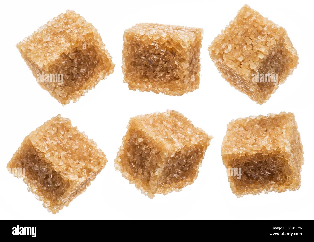 Brown sugar cubes on white background. Macro picture. Stock Photo