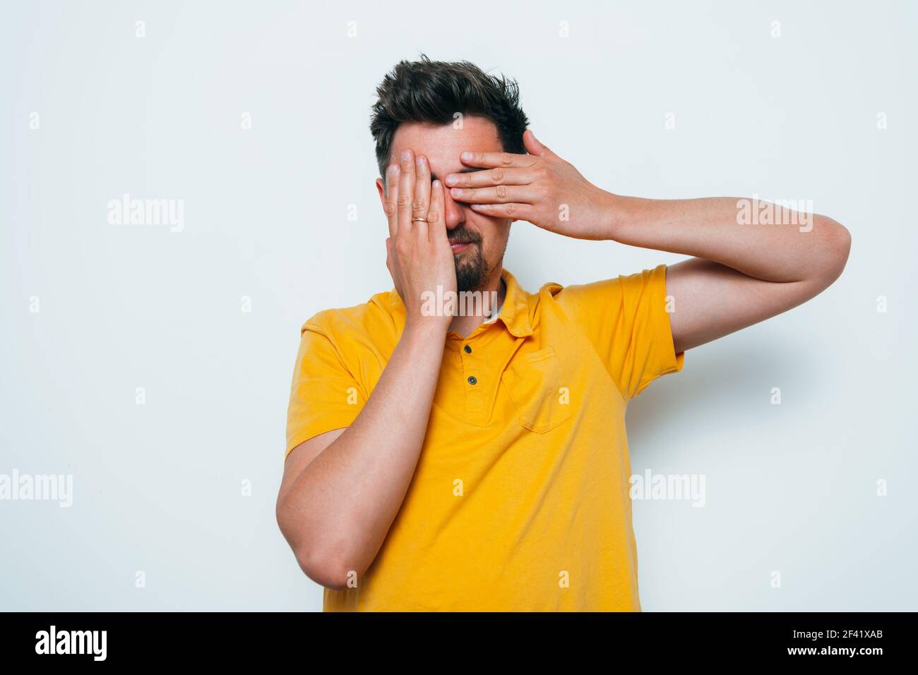 man covered his face with his hands Stock Photo - Alamy