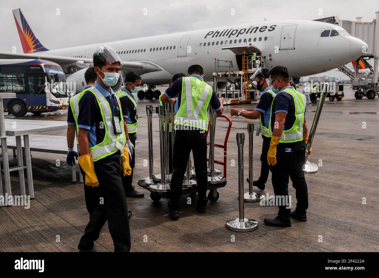 Airport personnel prepare to transfer crates of mock vaccines during a simulation at the Ninoy Aquino International Airport (NAIA) Terminal 2 in Pasay City, Metro Manila, Philippines. Stock Photo