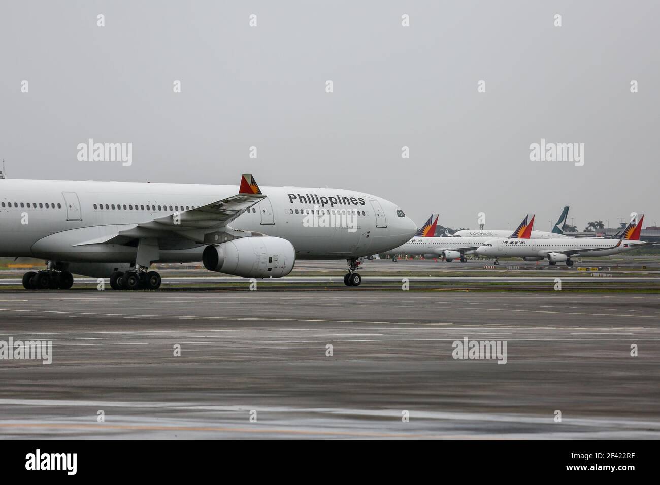 A Philippine Airlines plane is set to take off on the tarmac of the Ninoy Aquino International Airport (NAIA) Terminal 2 in Pasay City, Metro Manila, Philippines. Stock Photo