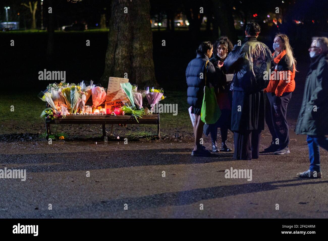London, UK. 13th March, 2021. People attend a Vigil in memory of Sarah Everard at the Clapham Common bandstand, where floral tributes have been accumulating. the remains of Ms Everard were found in a woodland area in Ashford, a week after she went missing as she walked home from visiting a friend in Clapham. Metropolitan Police Officer Wayne Couzens has been charged with her kidnap and murder raising concerns over women’s safety. The Police are being criticised over their response to the Vigil where the enforcement of Covid Regulations  ended with the arrest of 4 people. Credit: Joao Daniel Pe Stock Photo