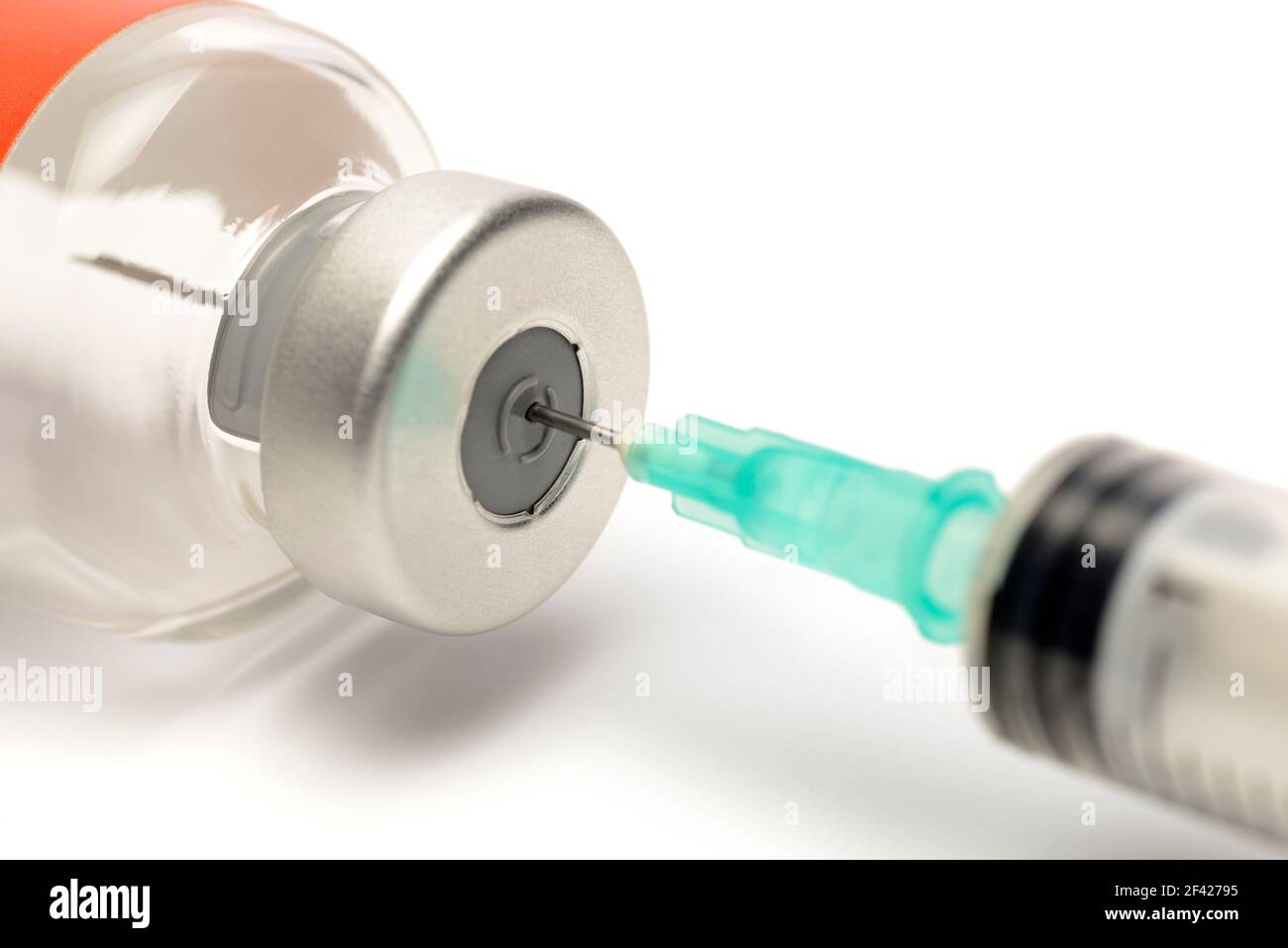 Syringe in a Glass Vial Preparing for an Injection Stock Photo