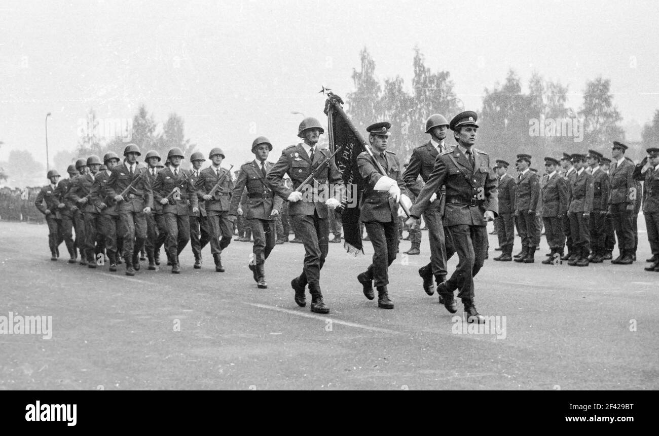 MARIANSKE LAZNE, CZECH REPUBLIC, 1985, Armed soldiers march with a battle flag during a military parade. Military ceremony of the Czechoslovak People' Stock Photo