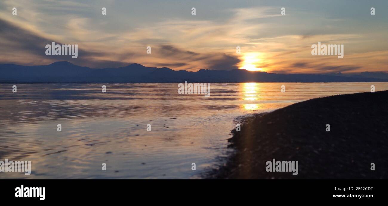 A beautiful sunset over the lake Sevan in Armenia Stock Photo