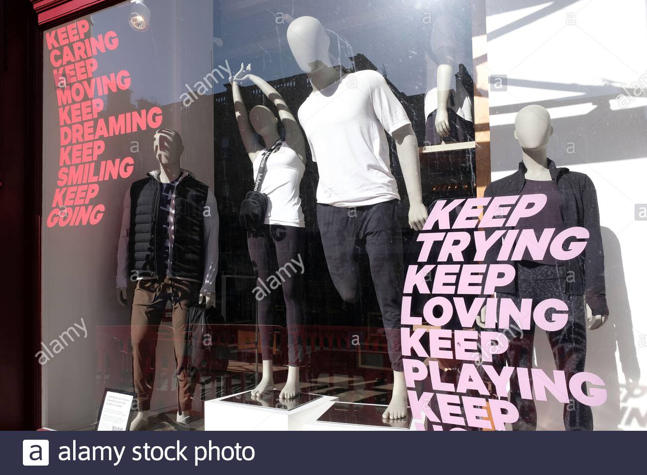 Mannequins in closed shop window with messages of encouragement and support during the Coronavirus Covid-19 lockdown Stock Photo
