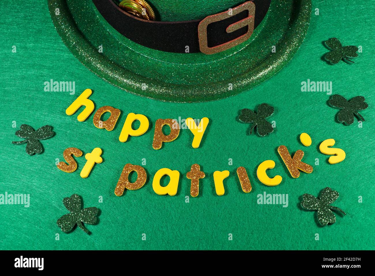 Happy St Patrick's Leprechaun Hat With Coins And Shamrock Clovers Stock Photo