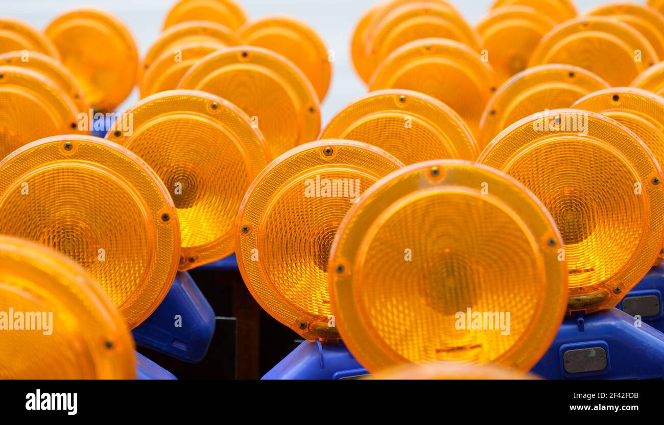 multiple road construction, safety yellow, traffic warning lights Stock Photo