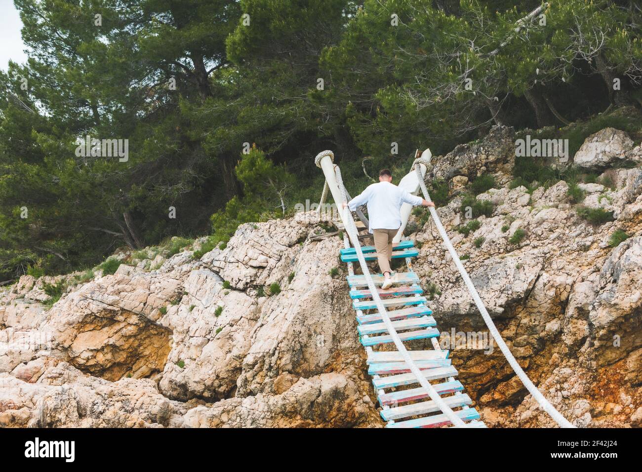 man walking by suspension bridge cross sea famous landmark Stock Photo ...