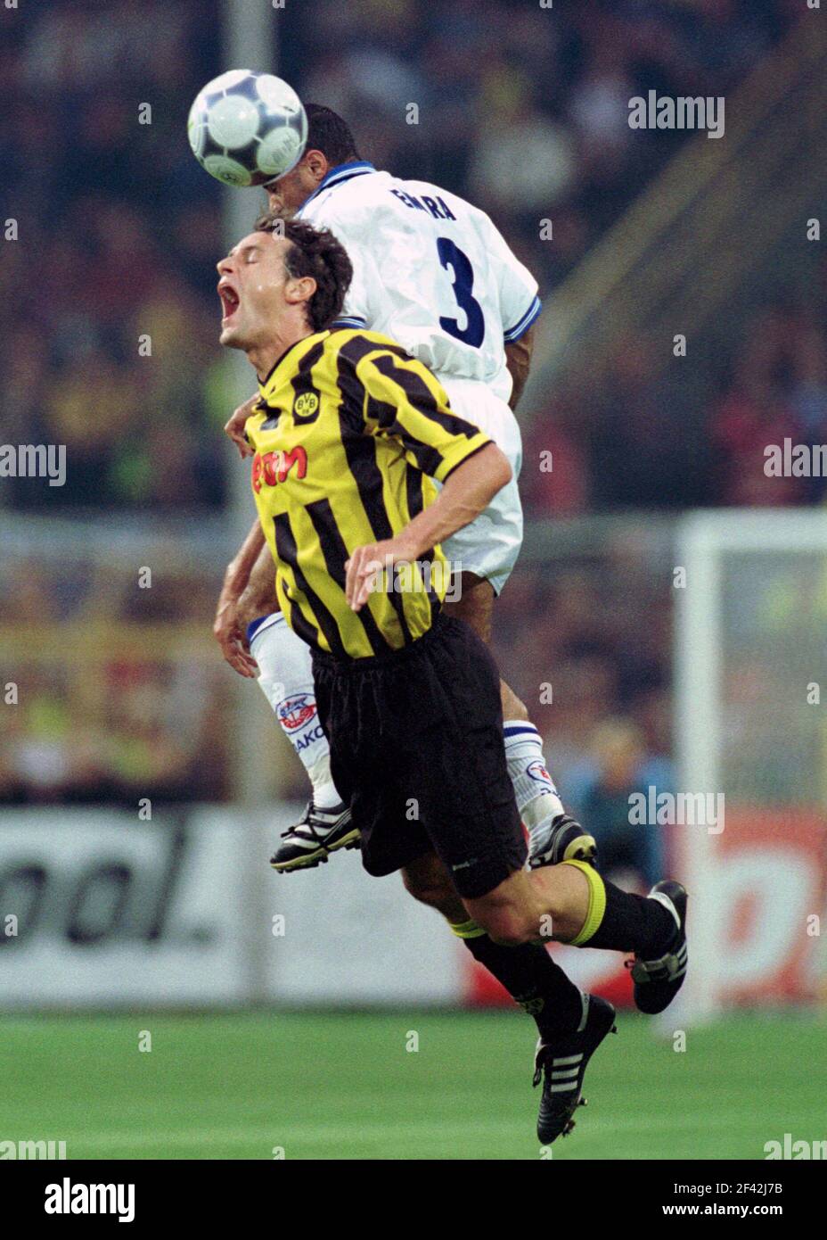 Dortmund, Germany 11.8. 2000, Football:  Bundesliga season 2000/01,  Borussia Dortmund (BVB, yellow) vs Hansa Rostock (HRO, white) 1:0 - Heiko HERRLICH (BVB),  Mohammed EMARA (HRO) Stock Photo