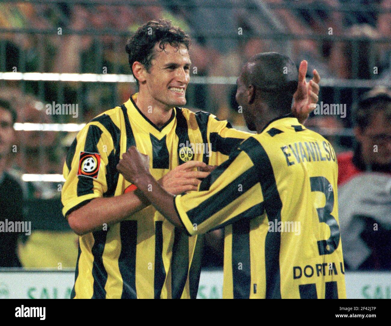 Dortmund, Germany 11.8. 2000, Football:  Bundesliga season 2000/01,  Borussia Dortmund (BVB, yellow) vs Hansa Rostock (HRO, white) 1:0 - Heiko HERRLICH (BVB), EVANILSON (HRO) Stock Photo