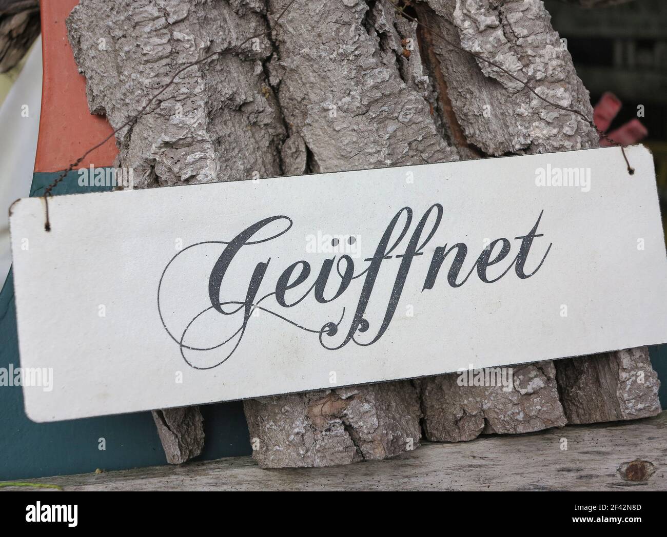 Metal sign with the German word 'Geöffnet' which translates into 'Open' in English language Stock Photo