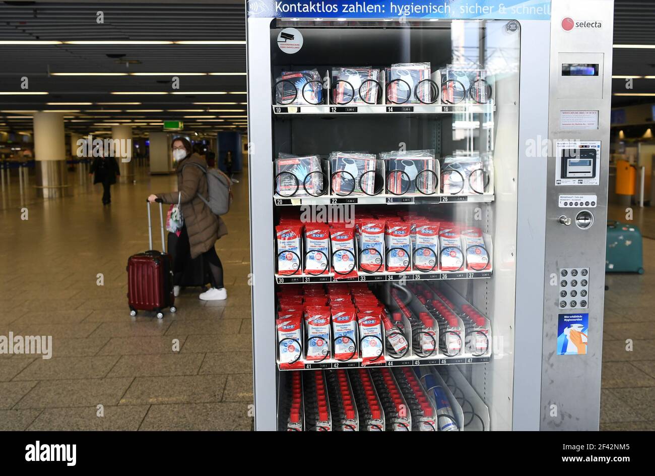 Frankfurt, Germany. 18th Mar, 2021. A vending machine selling protective and hygienic items is seen at an international airport in Frankfurt, Germany, on March 18, 2021. Daily COVID-19 infections in Germany continued to rise sharply as the country registered 17,504 cases within one day, the Robert Koch Institute (RKI) announced on Thursday. Credit: Lu Yang/Xinhua/Alamy Live News Stock Photo