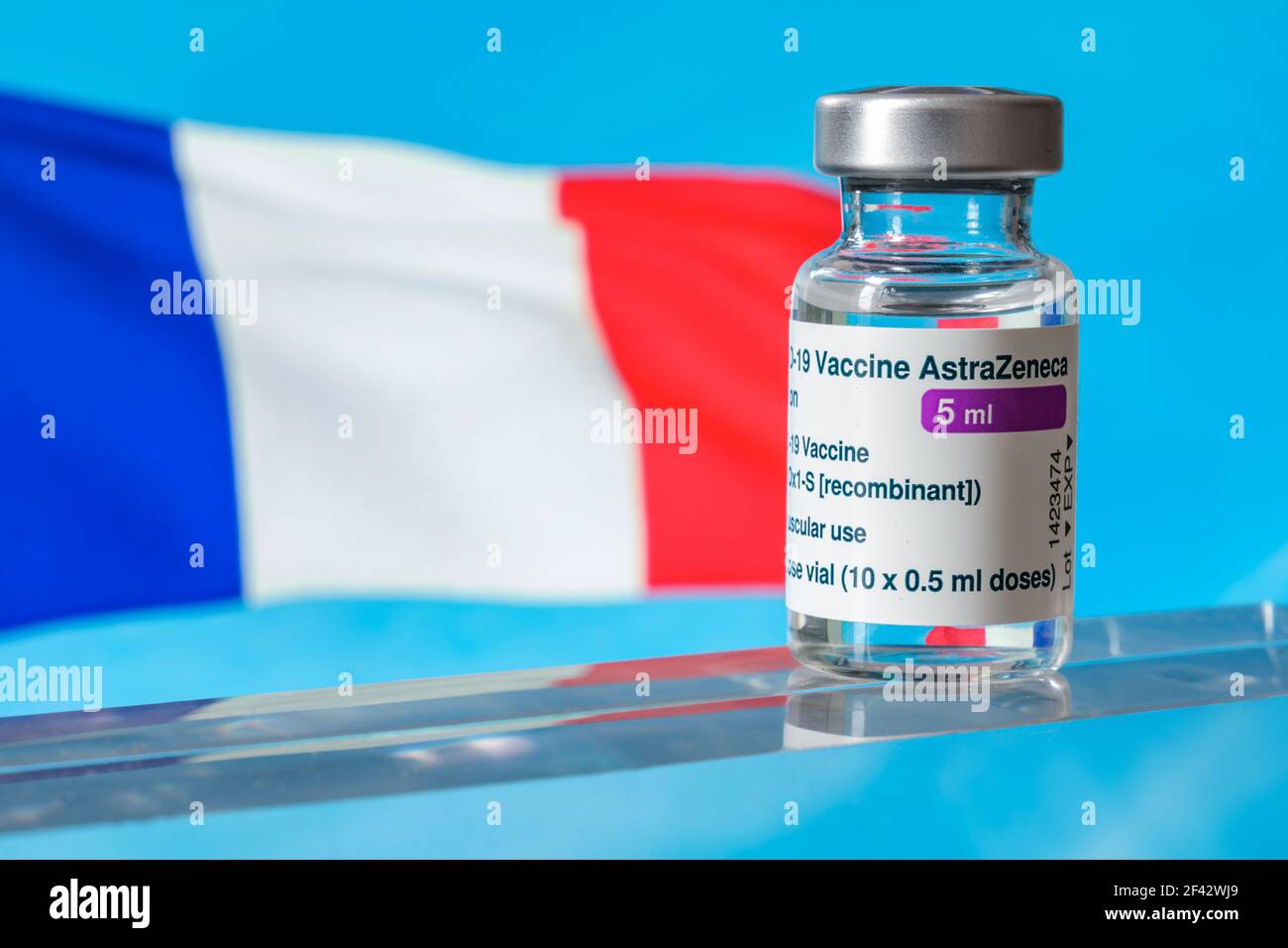 Montreal, CA - 18 March 2021: Vial of Astrazeneca Covid-19 vaccine in front of a France flag Stock Photo