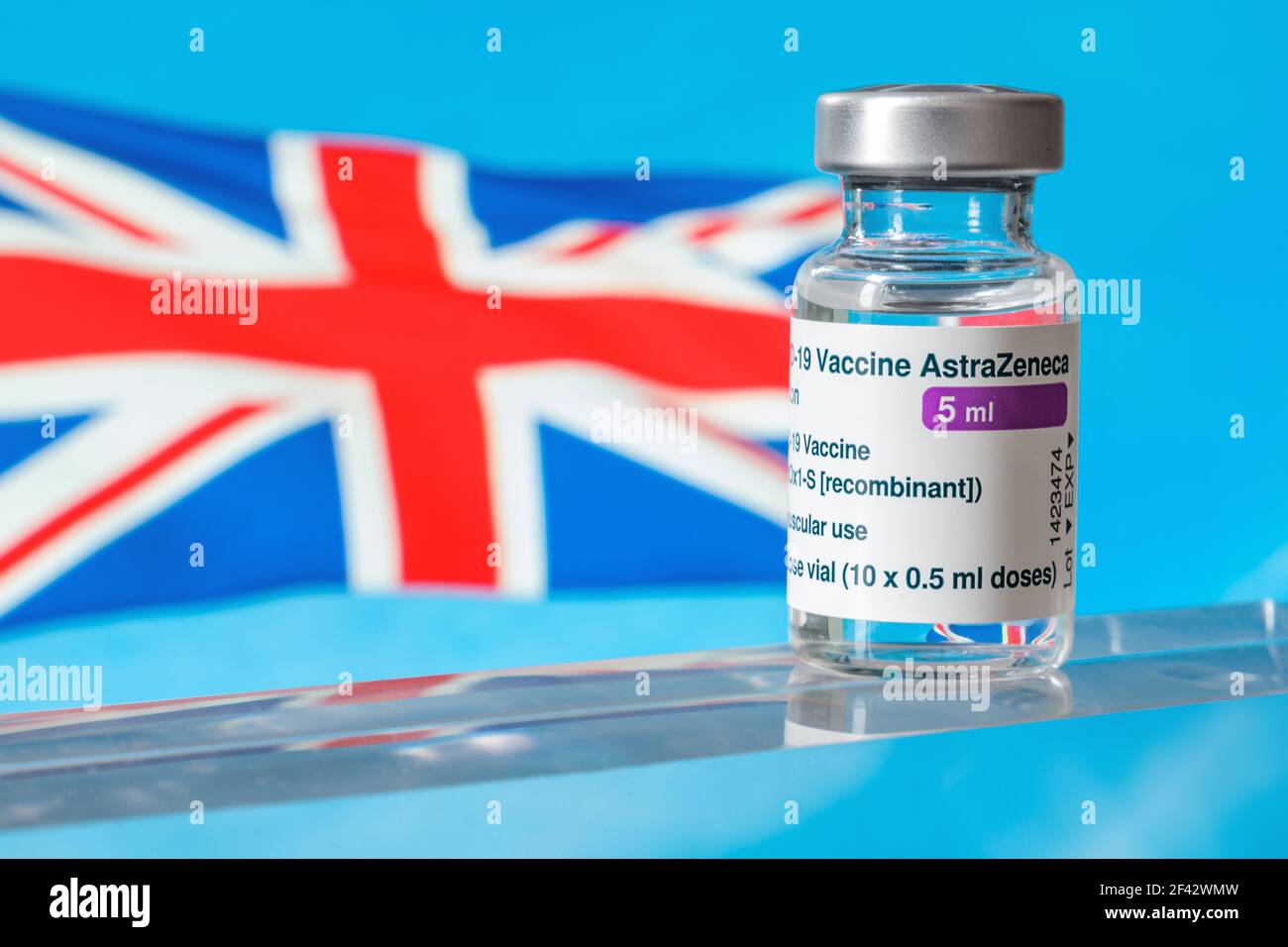 Montreal, CA - 18 March 2021: Vial of Astrazeneca Covid-19 vaccine in front of a United Kingdom flag Stock Photo
