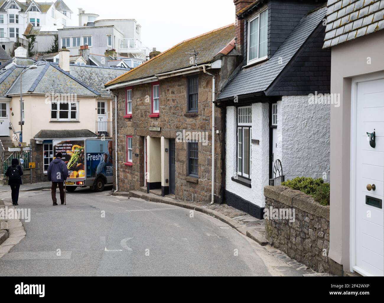 Tesco delivery van navigates the narrow lanes in St Ives, Cornwall, UK Stock Photo