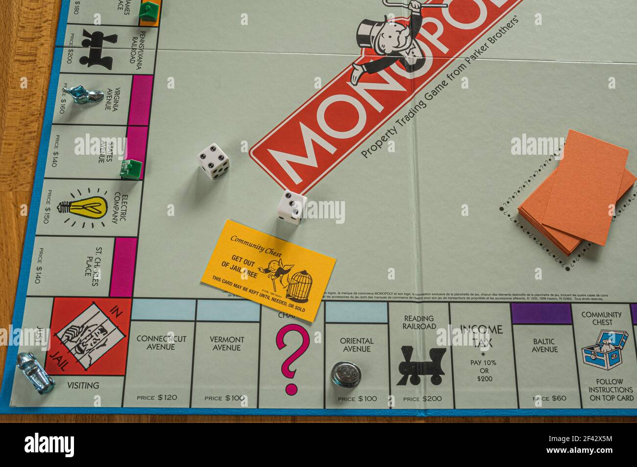 Monopoly board showing Get Out of Jail Free card along with dice Stock Photo