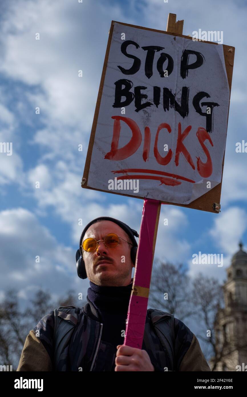 London, UK. 15th March, 2021. Protestor holds a sign reading 'stop being dicks'. Thousands gathered in Parliament Square to raise awareness on women’s safety and to oppose the PCSC bill. Police in central London made arrests on Monday night as thousands of people gathered to oppose the passage of a new policing bill and to highlight violence against women. The police, crime, sentencing and courts bill has been criticised by civil society groups as an attack on some of the most fundamental rights of citizens. Protests around the bill have become entwined with those in response to the death of S Stock Photo