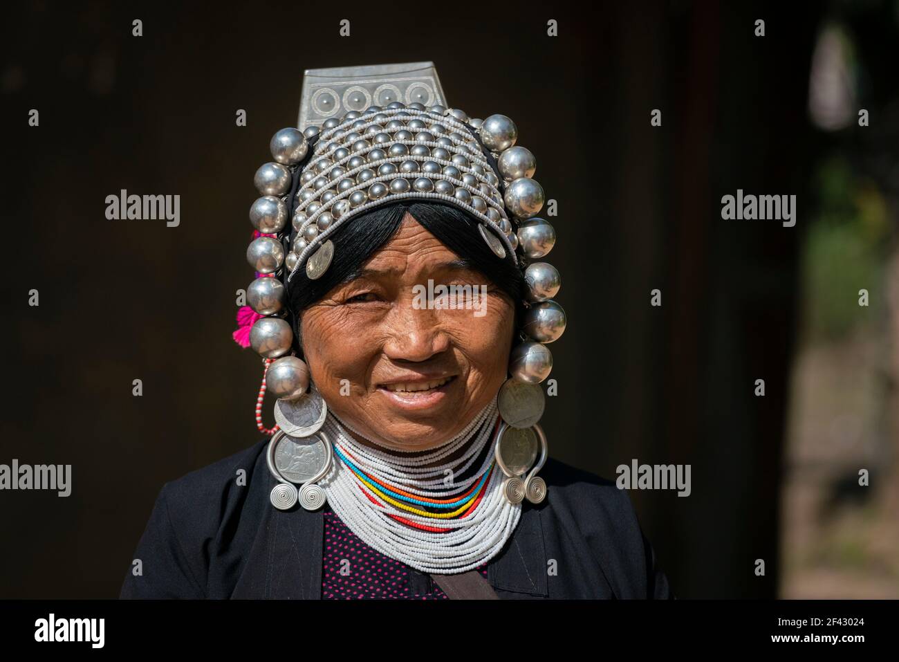Portrait of smiling adult woman of Akha tribe near Kengtung, Myanmar Stock Photo
