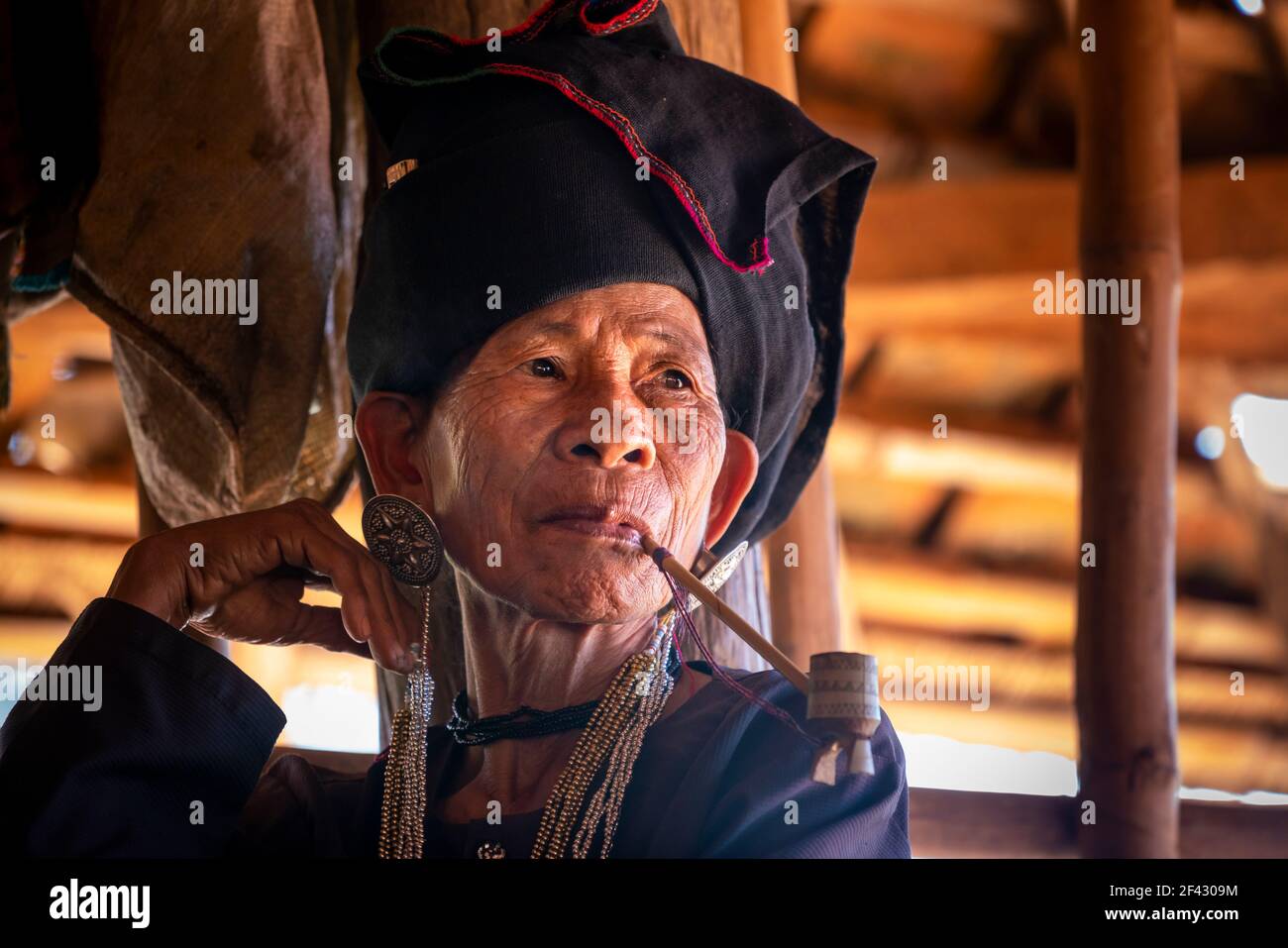 Senior lady of Akhu tribe smoking pipe near Kengtung, Myanmar Stock Photo Alamy