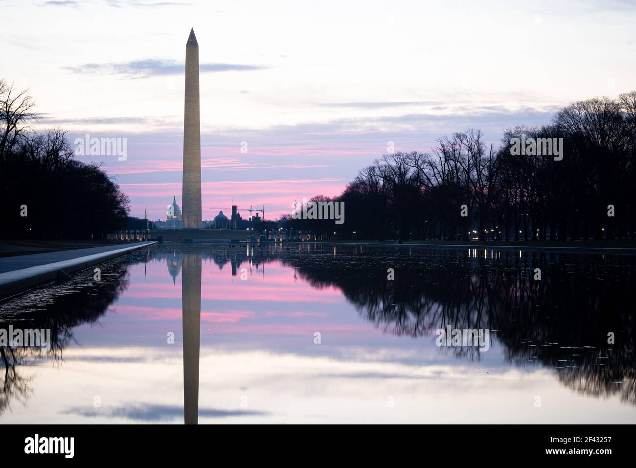 Sunrise photo of the Reflecting Pool, and the National Mall Stock Photo