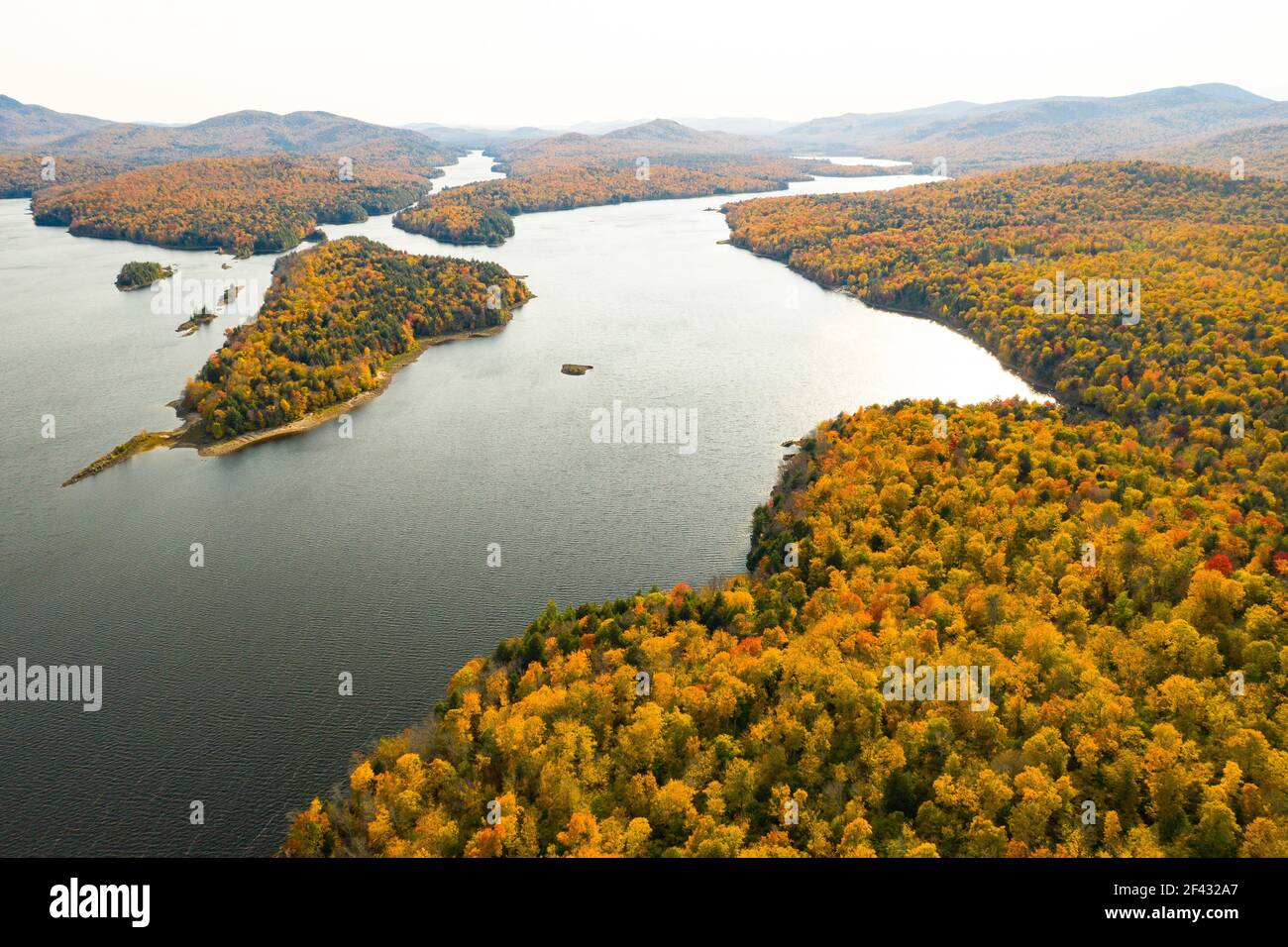 Lake in Colorful Autumn Adirondack Forest from Above Stock Photo