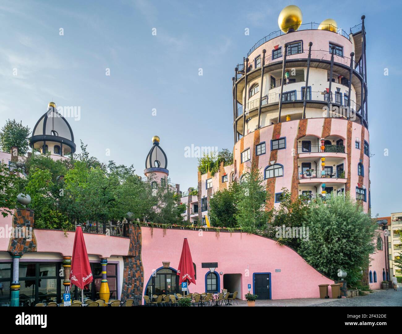 'Die Grüne Zitadelle' or The Green Citadel of Magdeburg, a large, pink building of a modern architectural style designed by Friedensreich Hundertwasse Stock Photo