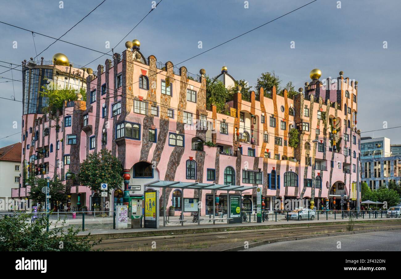 'Die Grüne Zitadelle' or The Green Citadel of Magdeburg, a large, pink building of a modern architectural style designed by Friedensreich Hundertwasse Stock Photo