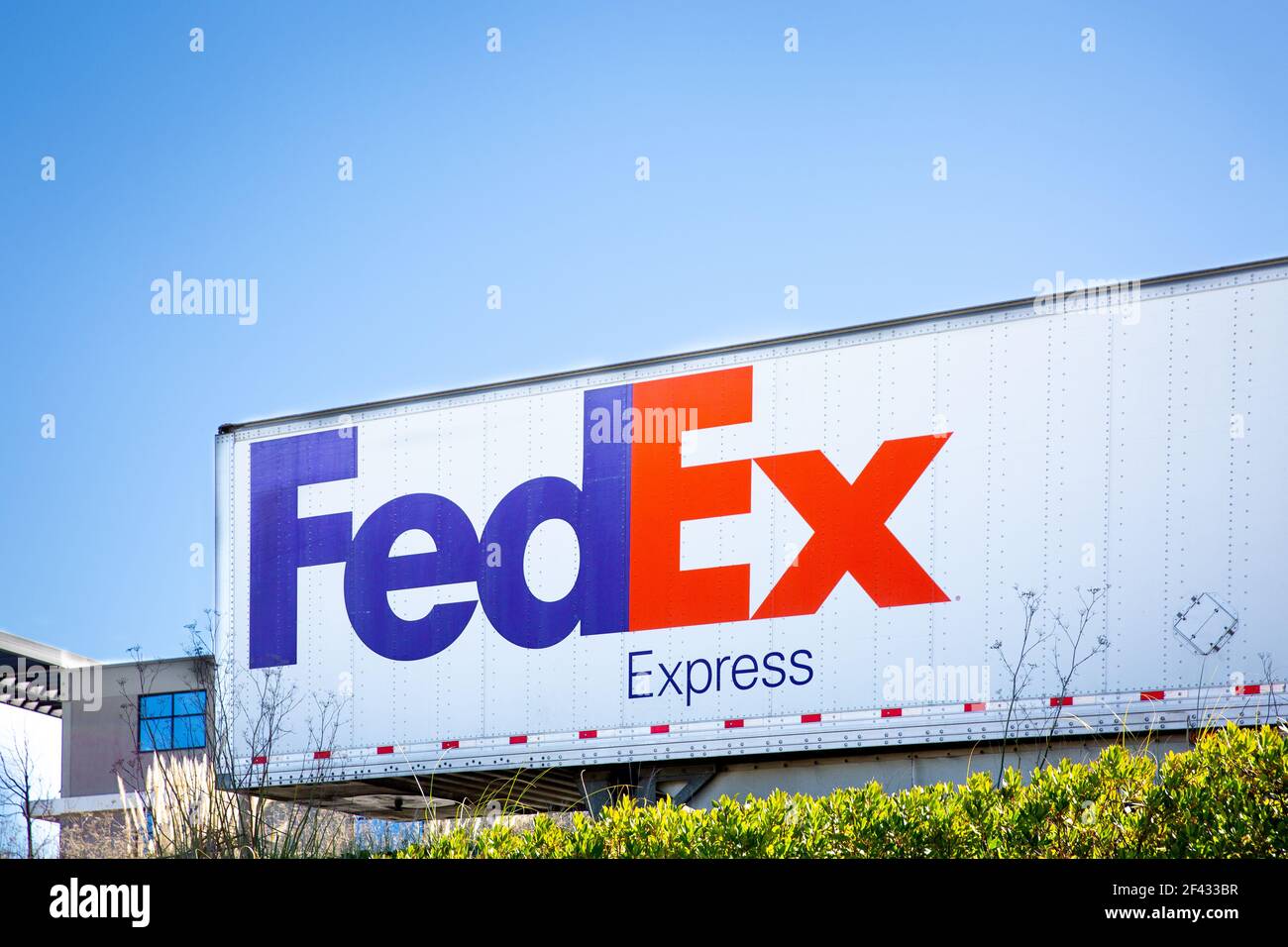 South San Francisco, CA, USA - February 24, 2021: Closeup of a Fedex container. FedEx Corporation is an American multinational delivery services compa Stock Photo