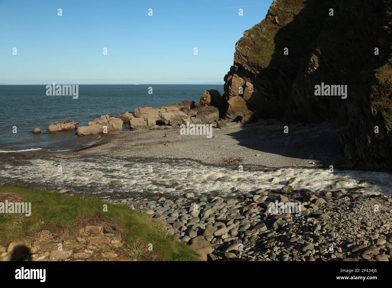 The national trust site of Heddon valley in it's full glory with the river gushing out to sea at Heddons mouth in North Devon, south west England foll Stock Photo