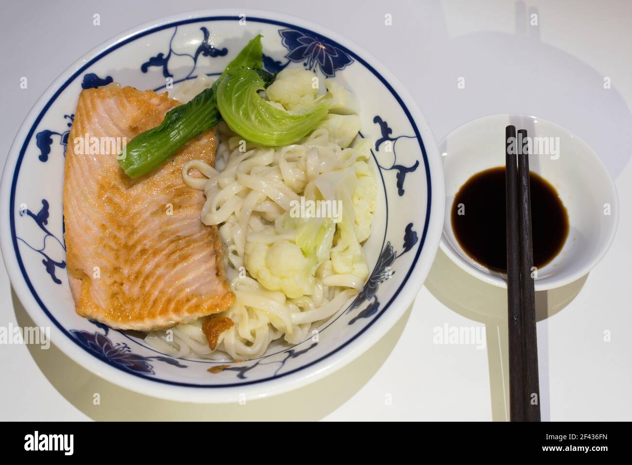 Salmon salad with avocado, green leaves and toasted breads Stock Photo