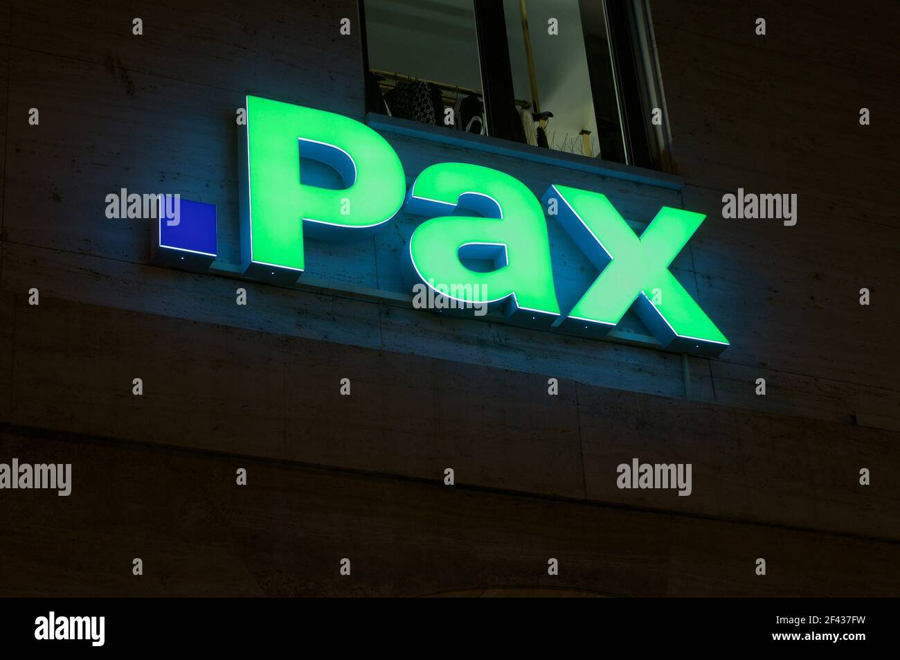 Lugano, Ticino, Switzerland - 14th January 2021 : Luminous Pax assurance sign hanging on a building in Lugano, Switzerland. PAX is a swiss life insure Stock Photo