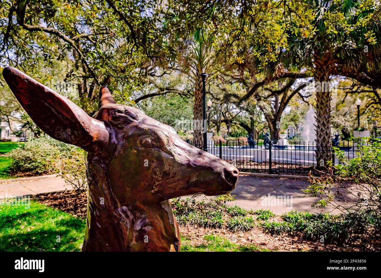 A deer statue stands in Washington Square in Mobile, Alabama. Washington Square is a picturesque park located in the Oakleigh Garden Historic District. Stock Photo