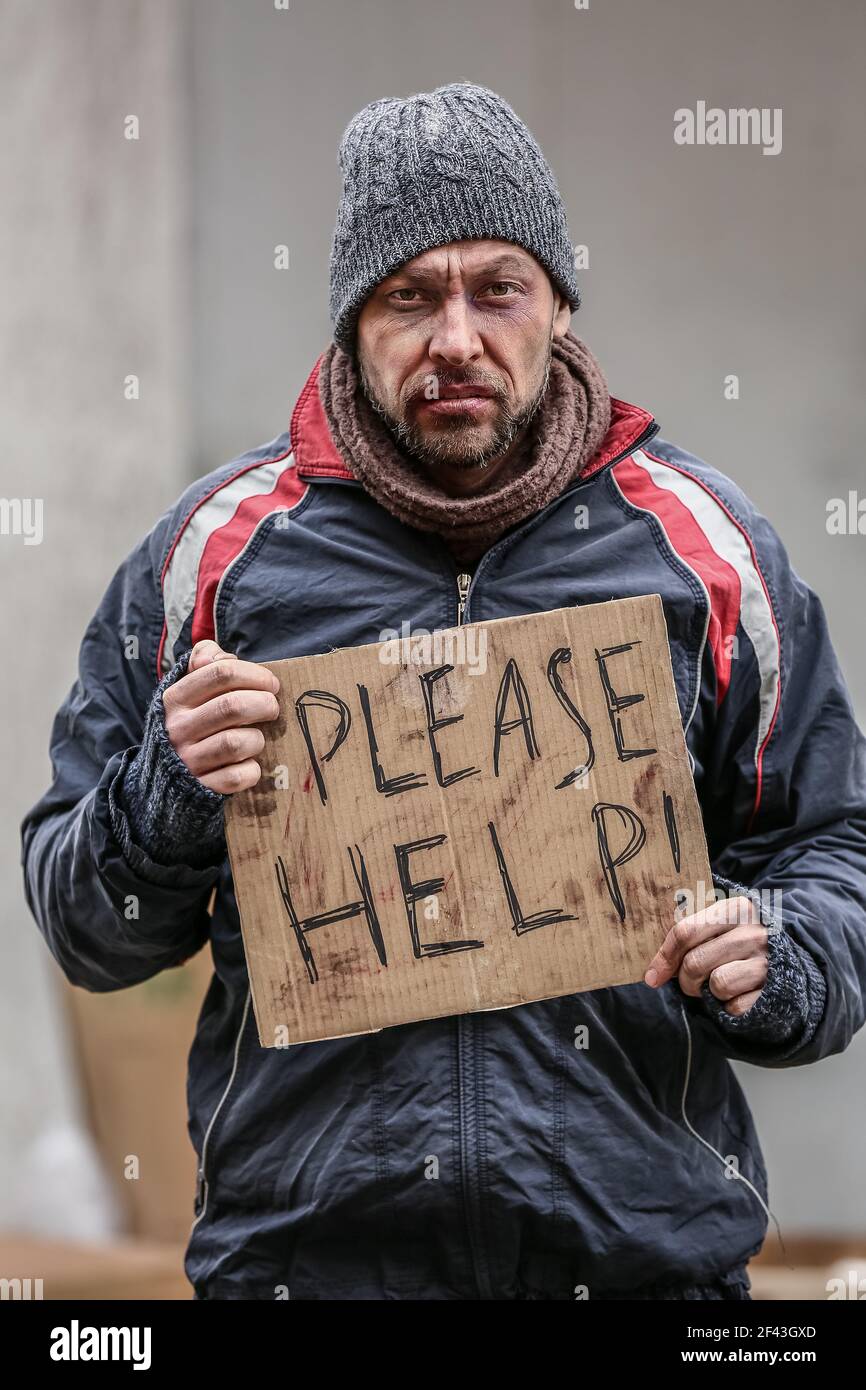 poor-homeless-man-begging-for-food-outdoors-on-winter-day-2F43GXD.jpg