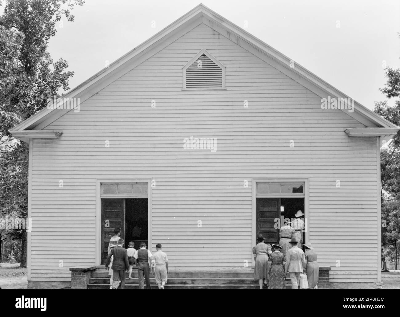 Congregation entering church. Wheeley's Church. Person County, North Carolina July 1939.Photograph by Dorothea Lange. Stock Photo