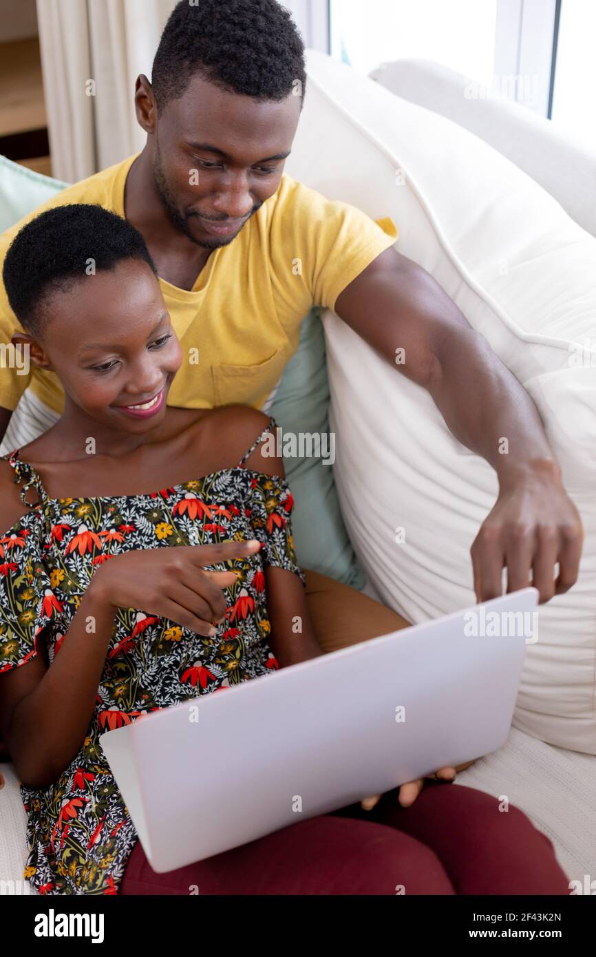 African american couple smiling using hi-res stock photography and ...