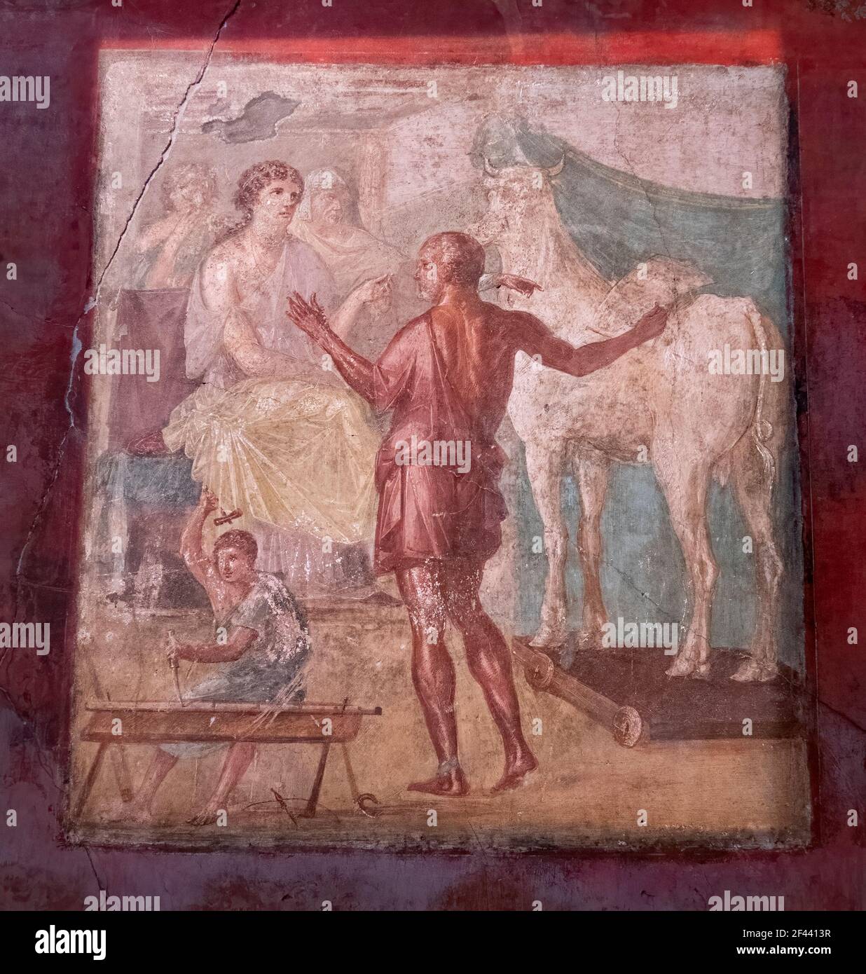 NAPLES, ITALY- JUNE, 13, 2019: NAPLES, ITALY- JUNE, 13, 2019: a fresco painting of daedalus and pasiphae in the house of the vettii in pompeii Stock Photo
